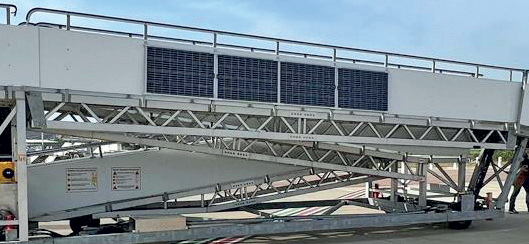 The Aviramp boarding ramp depicted in the image showcases a modern, well-designed structure dedicated to facilitating passenger boarding and disembarkation. These ramps are an essential part of airport infrastructure, especially at larger or more modern airports, providing a smooth, safe, and efficient way for travellers to access aircraft. This particular ramp appears to be constructed with durable materials like metal and possibly composite panels, ensuring stability and longevity. Its design likely includes features such as adjustable height to accommodate various aircraft types, safety rails, non-slip surfaces, and sheltered sections to protect passengers from weather conditions. The layout suggests it’s part of a larger terminal complex, possibly connected to multiple gates, allowing for quick turnaround times and efficient boarding processes. The ramp’s design emphasizes safety, comfort, and operational efficiency, helping airlines and ground staff manage passenger flow seamlessly. Overall, these ramps are vital for maintaining the high standards of safety, speed, and comfort expected in modern air travel, contributing significantly to the smooth operation of airport logistics.
