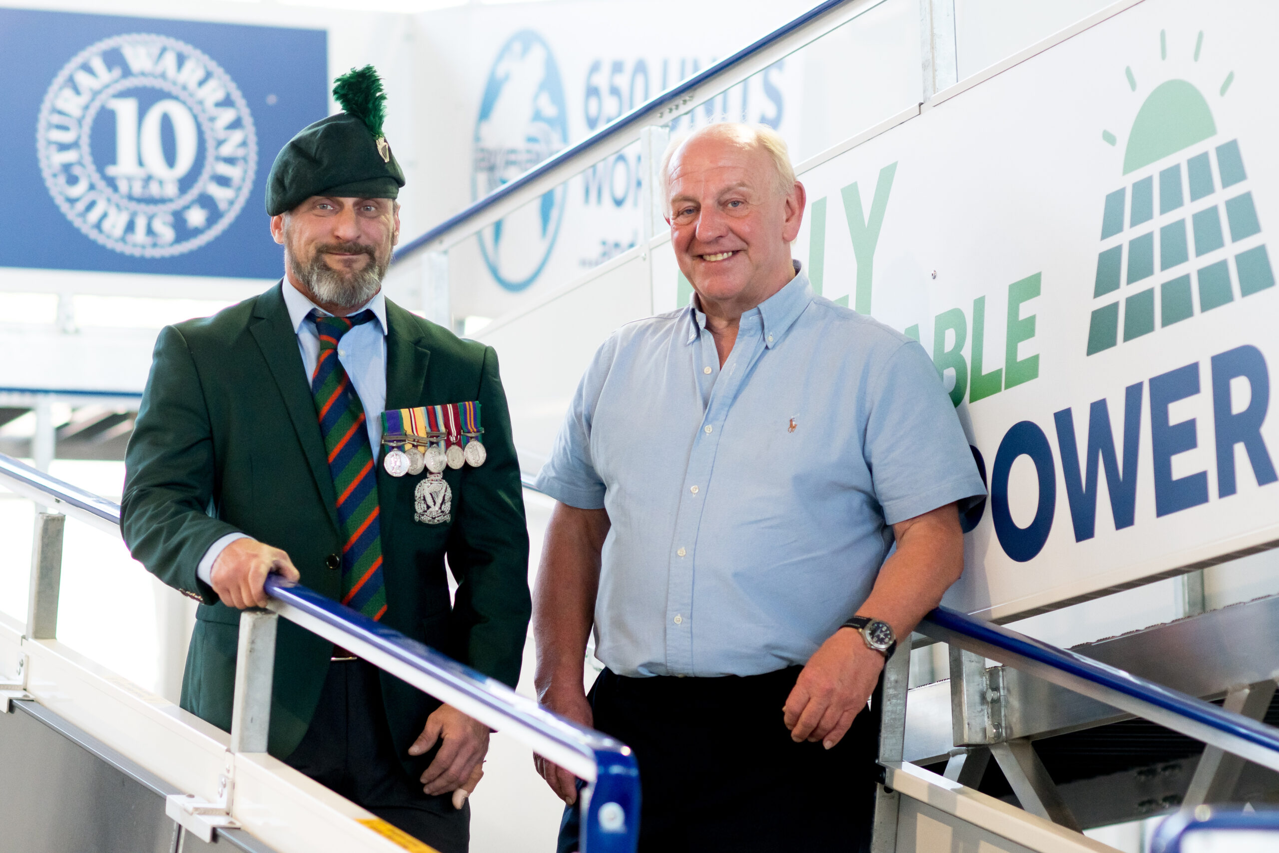 Veteran Stephen Kemp in uniform with Aviramp CEO Graham Corfield on an Aviramp